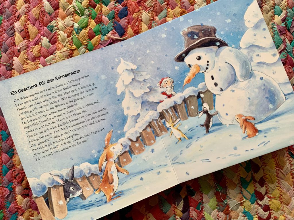 Aufgeschlagenes Weihnachtsbuch Meine schönsten Geschichten zur Weihnachtszeit mit Schneemann